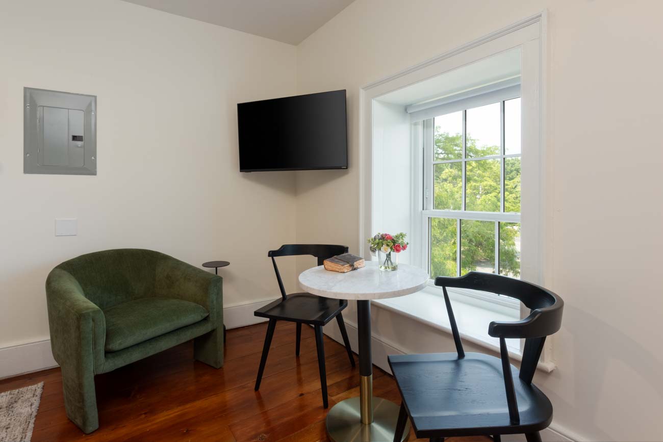 Cozy coffee table for two by a sunlit window in Lewiston, NY.